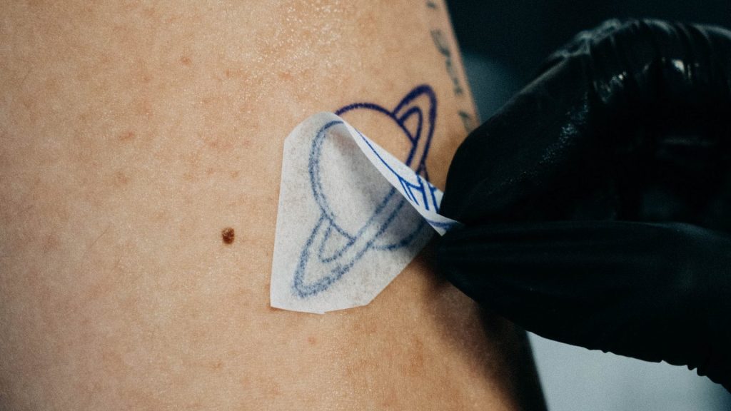 The Fridge Magnet Is Dead. Travelers Are Getting Tattooed Instead.